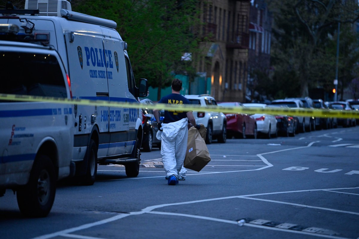 Crime scene detective at scene where man was shot dead in Brooklyn