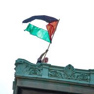 Columbia University protester waves Palestinian flag from rooftop