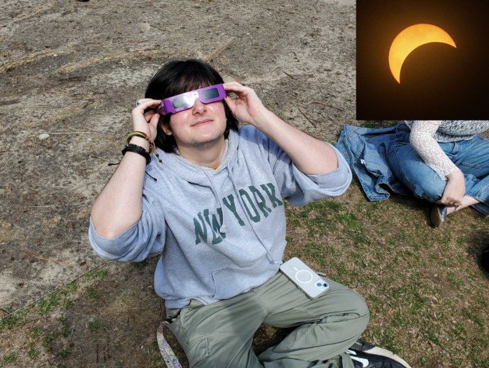 Brooklyn man looks at solar eclipse