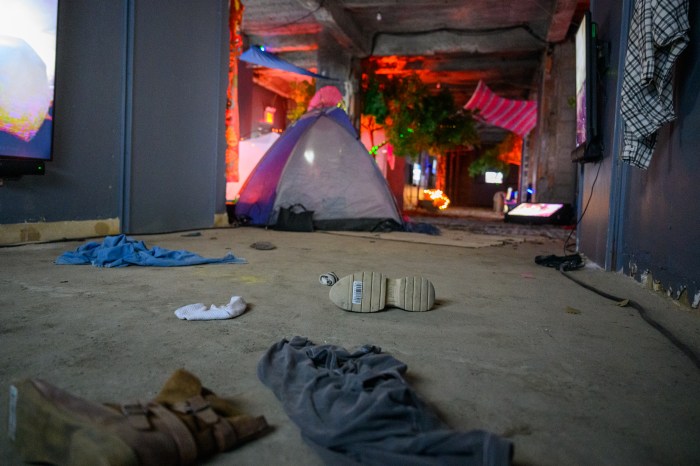 personal items including a shoe and a tent at the Nova Music Festival exhibit in NYC