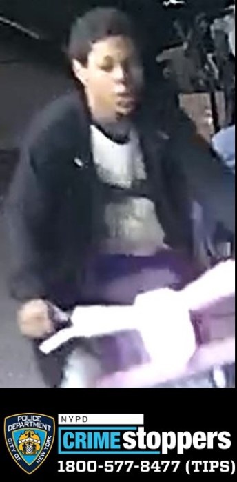 police photo of suspect wanted for assault in Brooklyn; he's wearing black jacket and on a bike