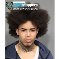 Police are searching for two men who allegedly assaulted a traffic agent in Harlem last week with a fire extinguisher. Police released photos of the suspects, including this man.