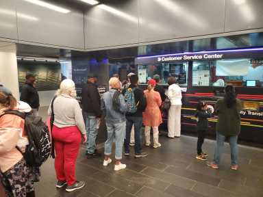 MTA commuters wait in line late