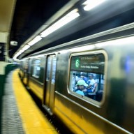MTA subway train traveling through Astor Place station