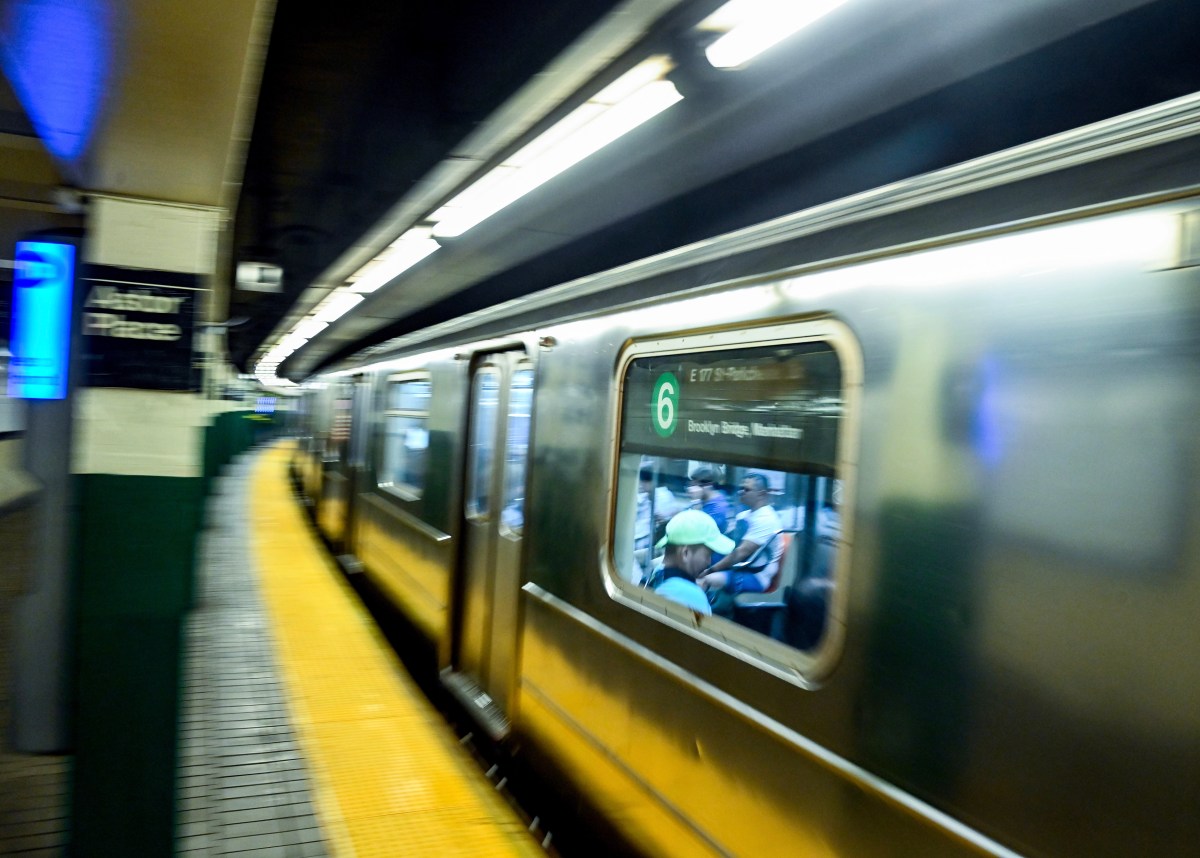 MTA subway train traveling through Astor Place station