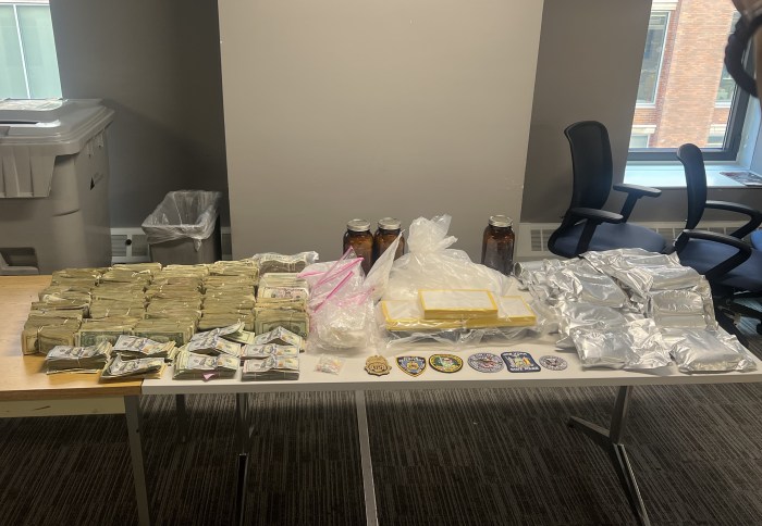 Fentanyl, cocaine and cash that was seized from a Bronx apartment displayed on a table
