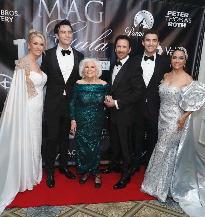 3 women and 3 mens standing at event