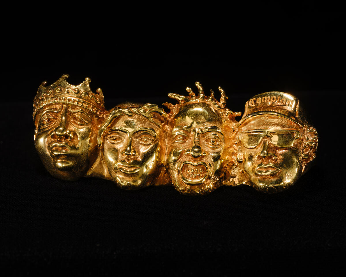 Designed by Johnny Nelson, the 14-karat Fingers of Def four-finger ring is from his Mount Rushmore series and honors four trailblazing male hip-hop artists: Biggie, Tupac, Ol’ Dirty Bastard, and Easy-E. Ice Cold: An Exhibition of Hip-Hop Jewelry is one of many art exhibits to see in NYC this summer.