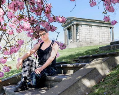 Jane Schoenbrun sits near crypt in Brooklyn cemetery