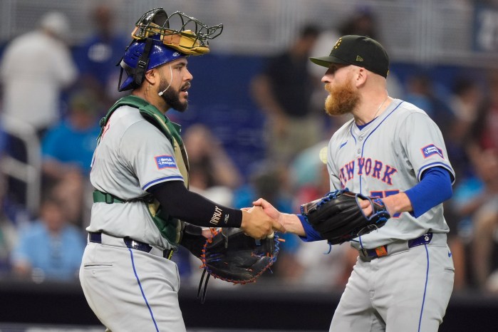 Mets reliever Reed Garrett shakes hands with catcher Tomas Nido