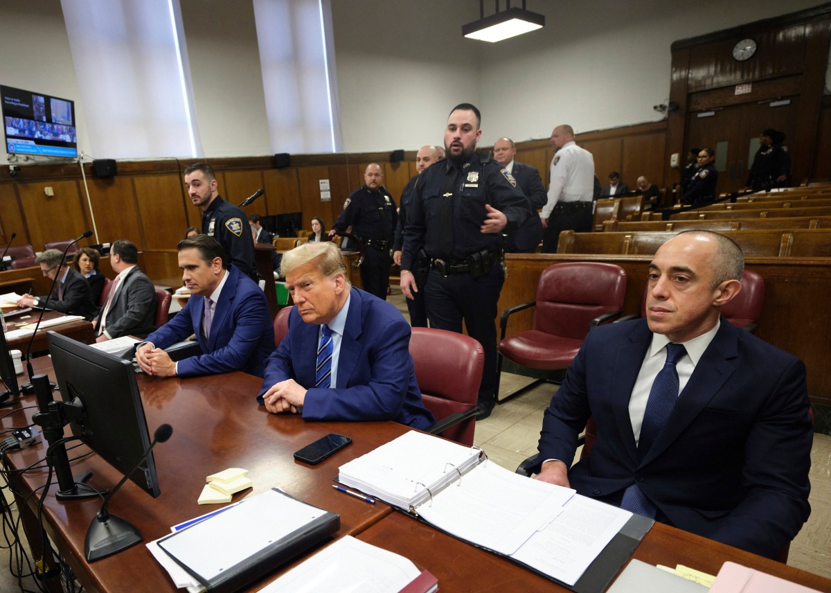 Donald Trump seated with lawyers in courtroom during trial