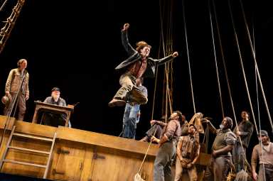 Actor leaping during production of Swept Away on Broadway