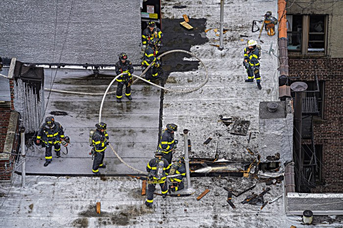 Firefighters battle Mother's Day fire on roof of Harlem building