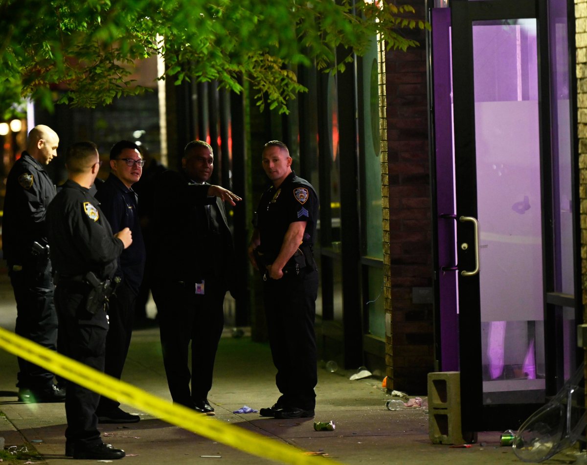 Police huddled at scene of Queens shooting