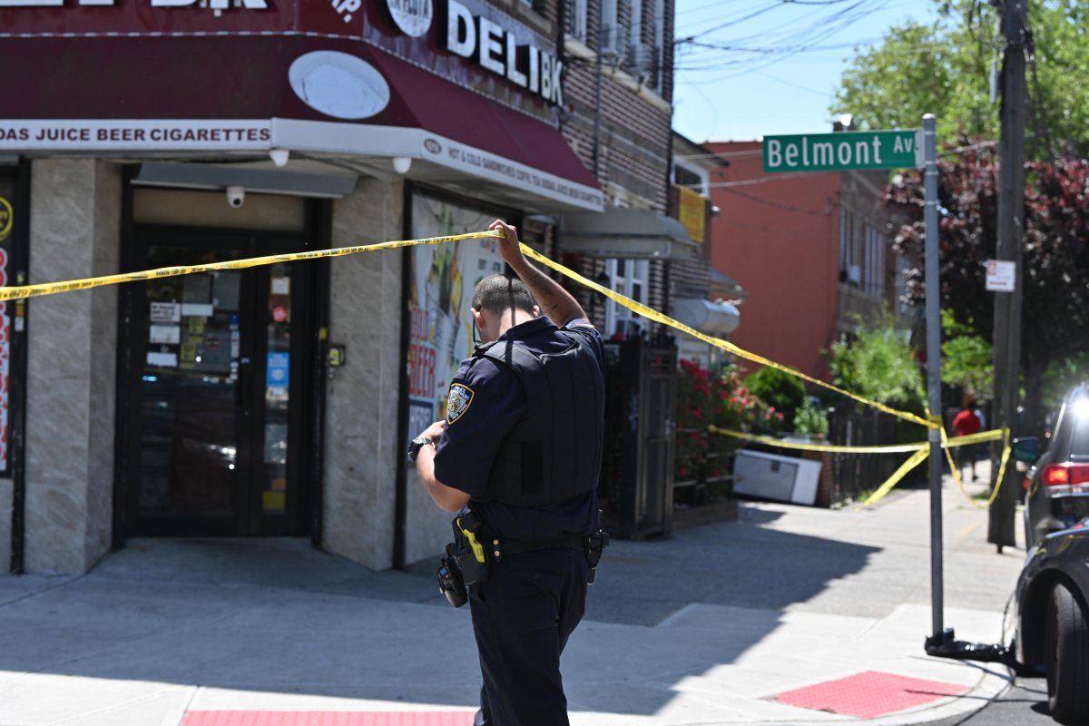 Police Officers and NYPD brass at the scene of a shooting at 1021 Belmont Avenue in Brooklyn.