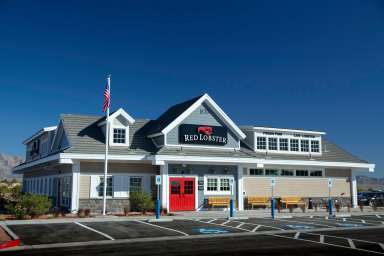 exterior of a Red Lobster restaurant shaped like a house