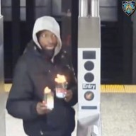 Subway arson attack holding flaming liquid at turnstile