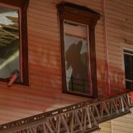 Silhouette of Brooklyn firefighter battling blaze