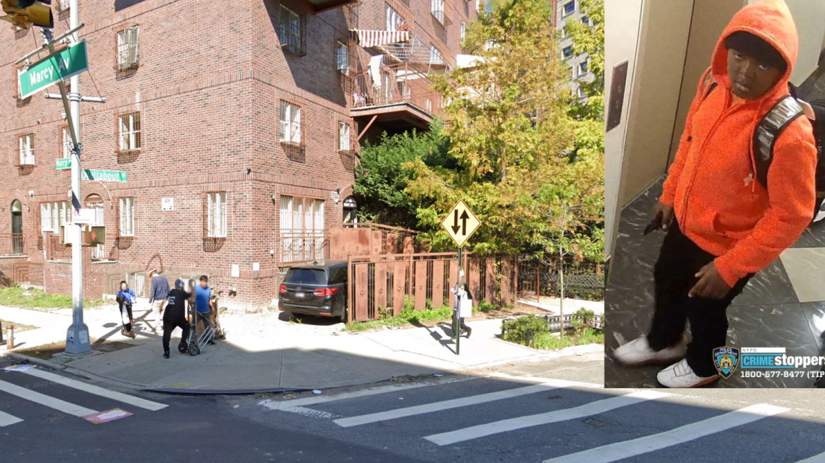 Brooklyn intersection in the daytime showing buildings and cars