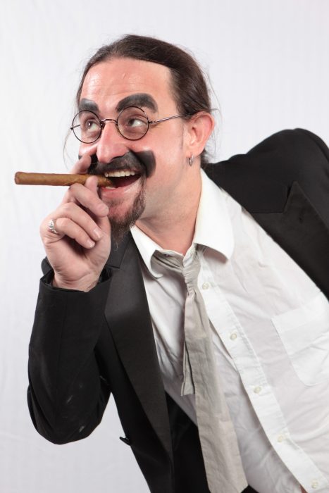 an actor dressed as Groucho Marx of the Marx Brothers