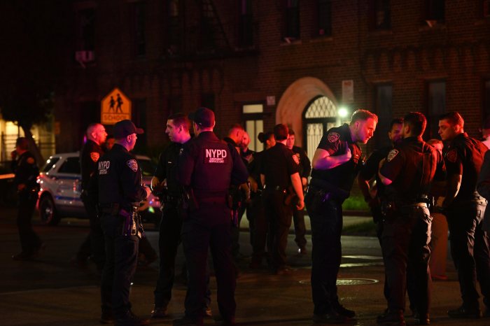 NYPD officer dragged by SUV during traffic stop in Brooklyn 2 NYPD officers at a crime scene at night in Brooklyn