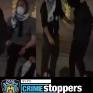 suspects in dark clothes and masks who allegedly defaced a memorial in Central Park