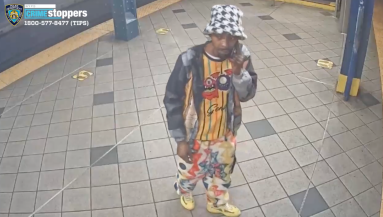 suspect in colorful clothes wanted for Midtown train robbery