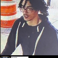 photo of suspect wearing glasses and mostly dark clothes wanted for stealing cameras in Central Park