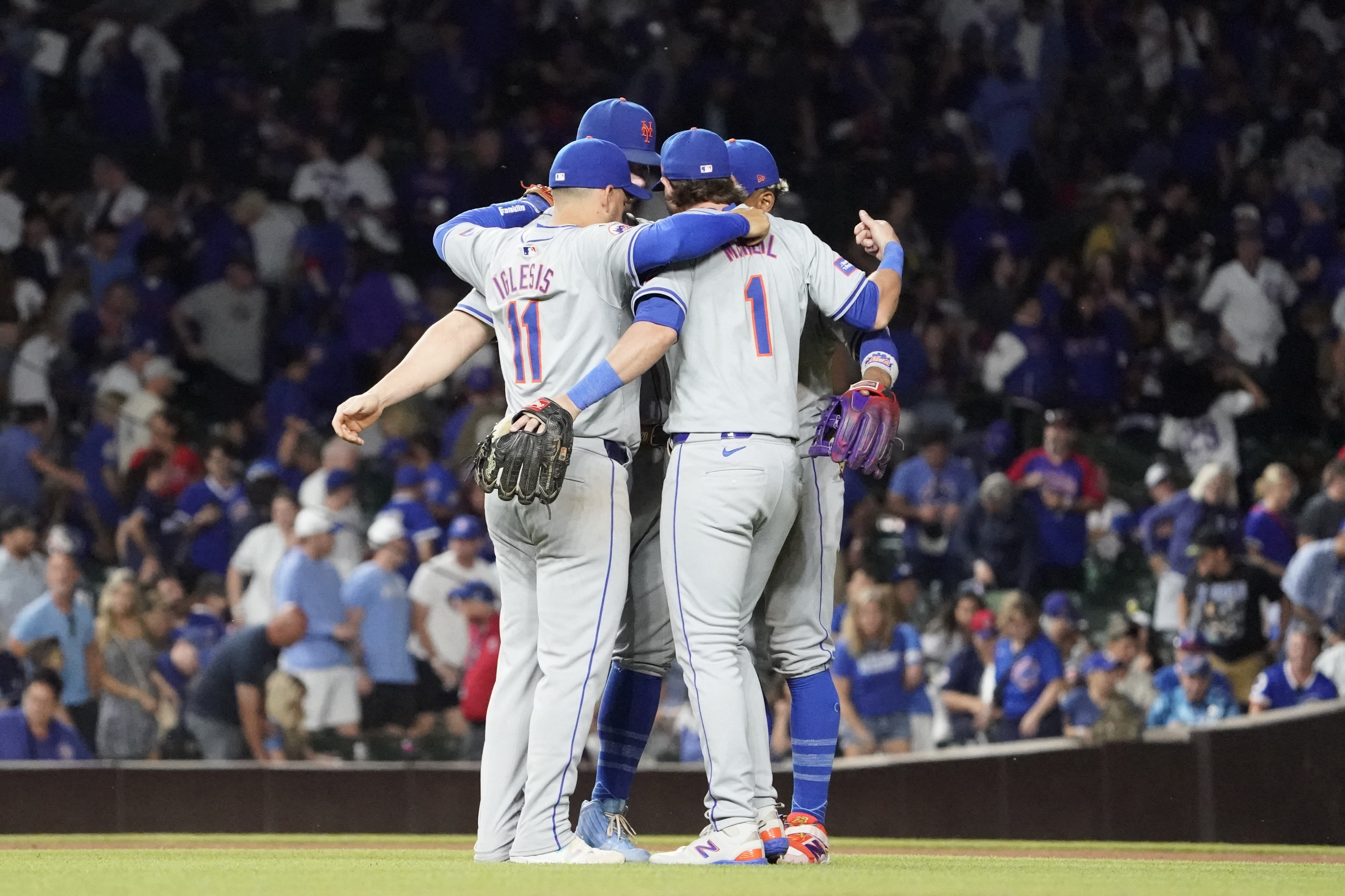  The New York Mets celebrate their win against the Chicago Cubs at Wrigley Field