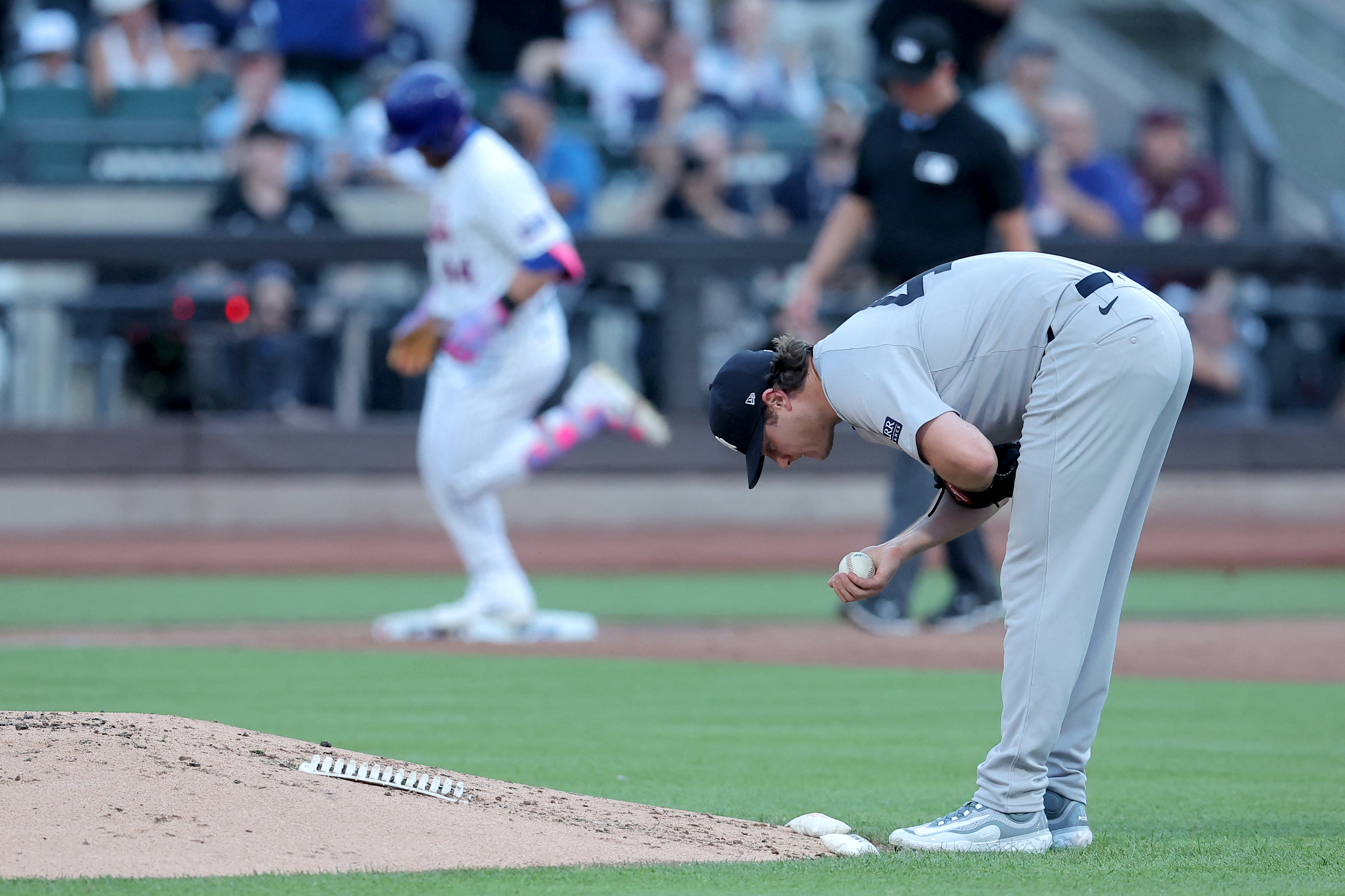 New York Yankees starting pitcher Gerrit Cole (45) reacts as New York Mets center fielder Harrison Bader