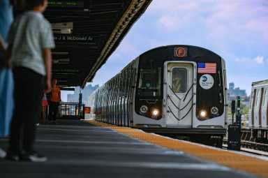 An F train arrives at a Brooklyn station