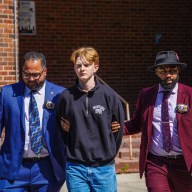 Hate crime suspect escorted in handcuffs by NYPD detectives