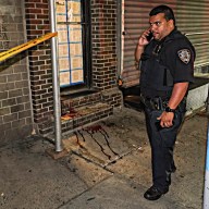 Officer at blood soaked crime scene where man was stabbed in Manhattan
