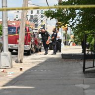 Police investigate a shooting at Pitkin Avenue and Ashford Street.