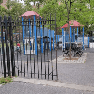 Little Flower Playground with climbing equipment and benches in Manhattan
