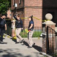 Crime scene detectives cross police line at Brooklyn shooting scene