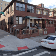street with a row of houses in the Bronx during the day