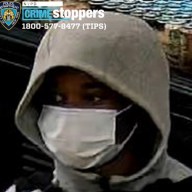 suspect in Bronx and Queens robbery wearing white mask
