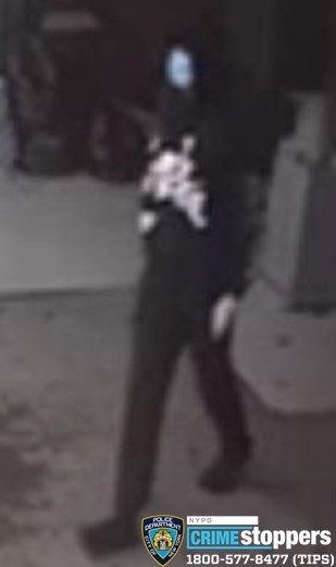 suspect wearing all black and walking 
