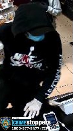 person wearing all black and a blue mask
