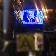 TV screen in New York showing news of President Biden dropping out of race