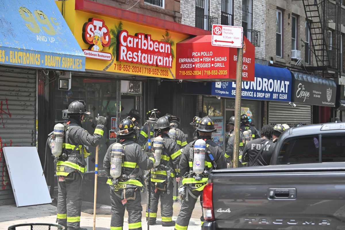 Firefighters battled a fire at Caribbean Restaurant, located at 116 Kingston Ave., in Crown Heights Saturday