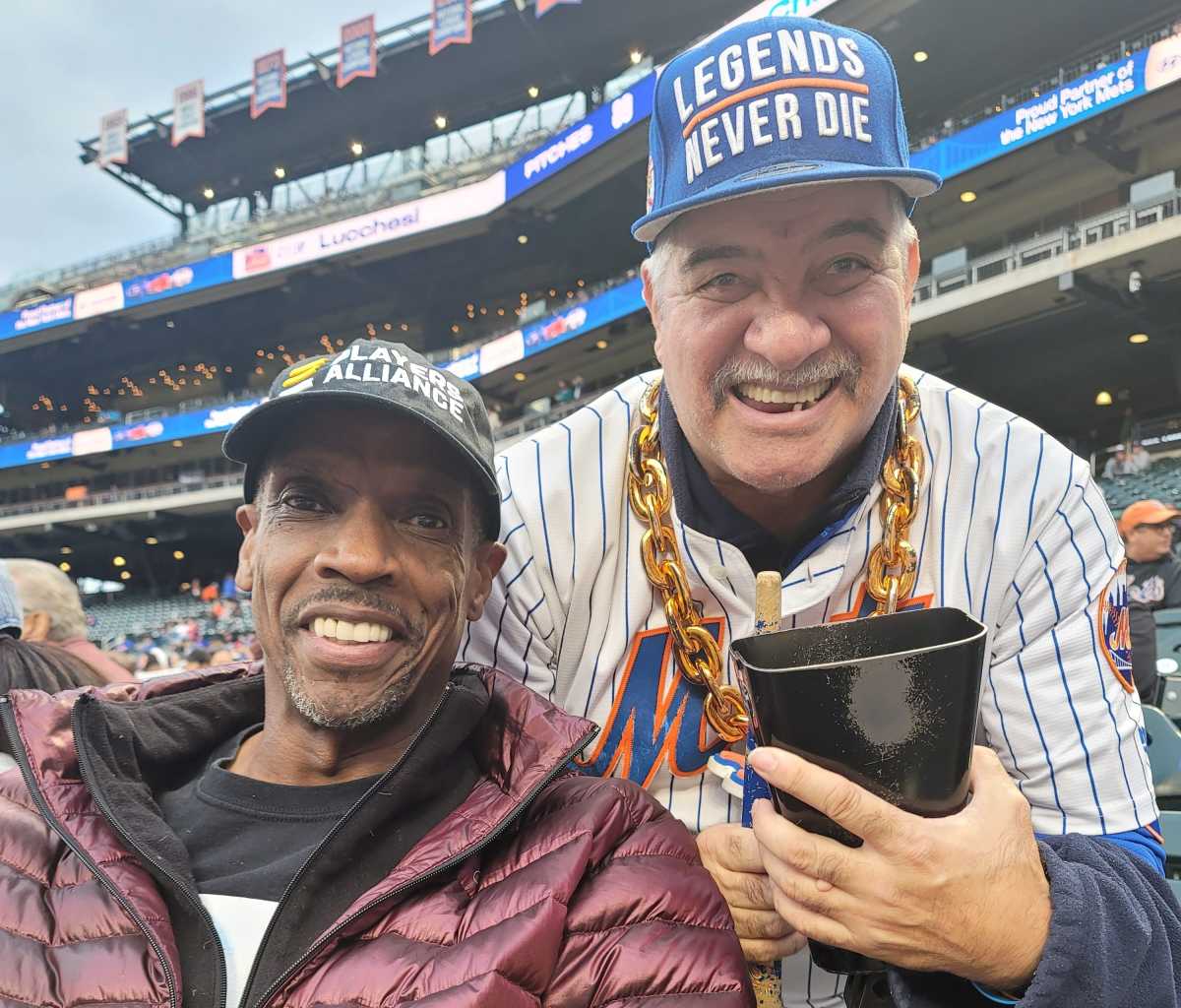 Cowbell Man Eddie Boison with Mets legend Doc Gooden.