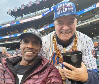 Cowbell Man Eddie Boison with Mets legend Doc Gooden.
