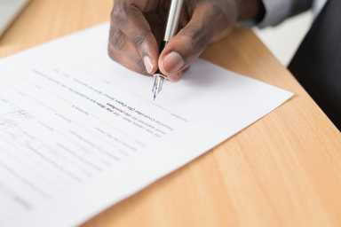 A men writing on paper