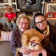 Dr. Ruth Westheimer sitting with a friend in her apartment