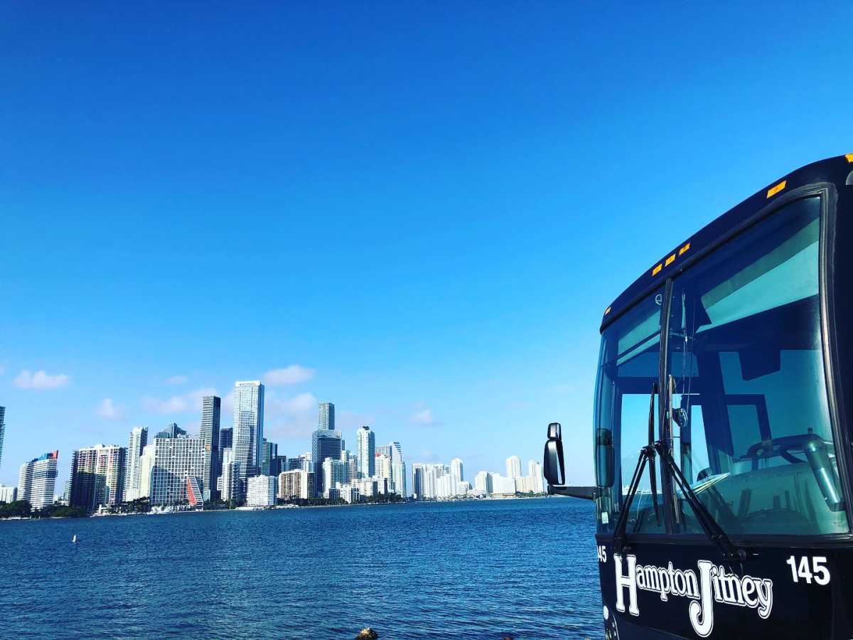 hampton jitney with NYC skyline in distance