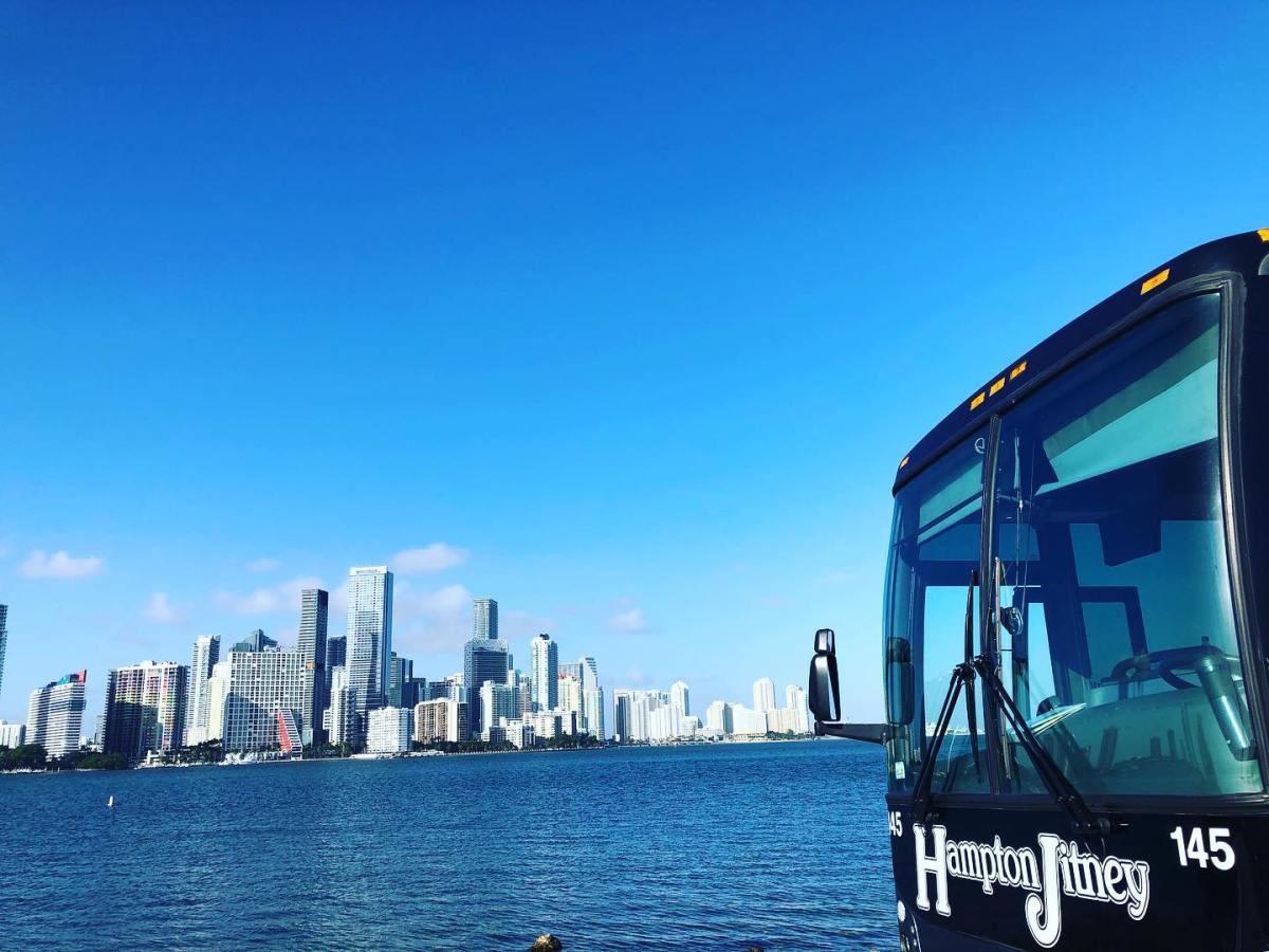 hampton jitney with NYC skyline in distance