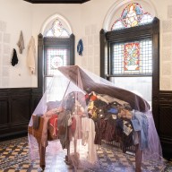 clothing inside a piano at an art exhibit at Green-Wood Cemetery in Brooklyn