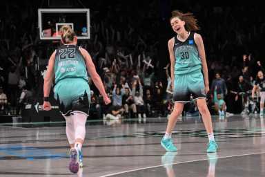 Two women basketball players